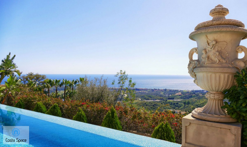 View of the coastline and sea from the back garden and pool